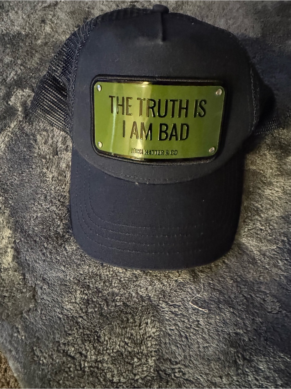 Black Trucker Hat with Green Metal Plate - 'The Truth Is I Am Bad'